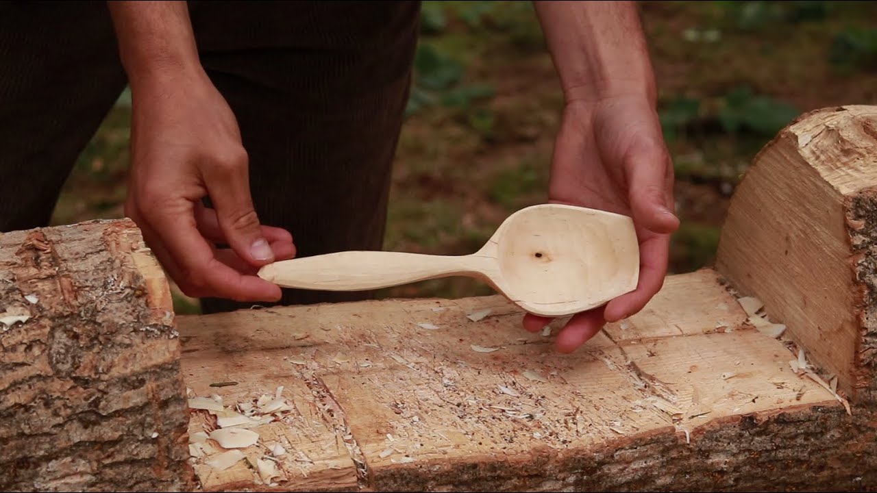 Carving a serving spoon out in the wilderness