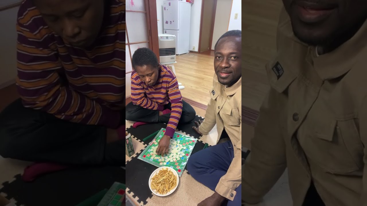 A Ghanaian coulpe sitting on the carpet to play scrabble game 🤣🥂in Japan