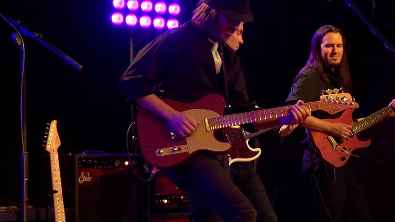 andy wood band covers make up and faded blue jeans.