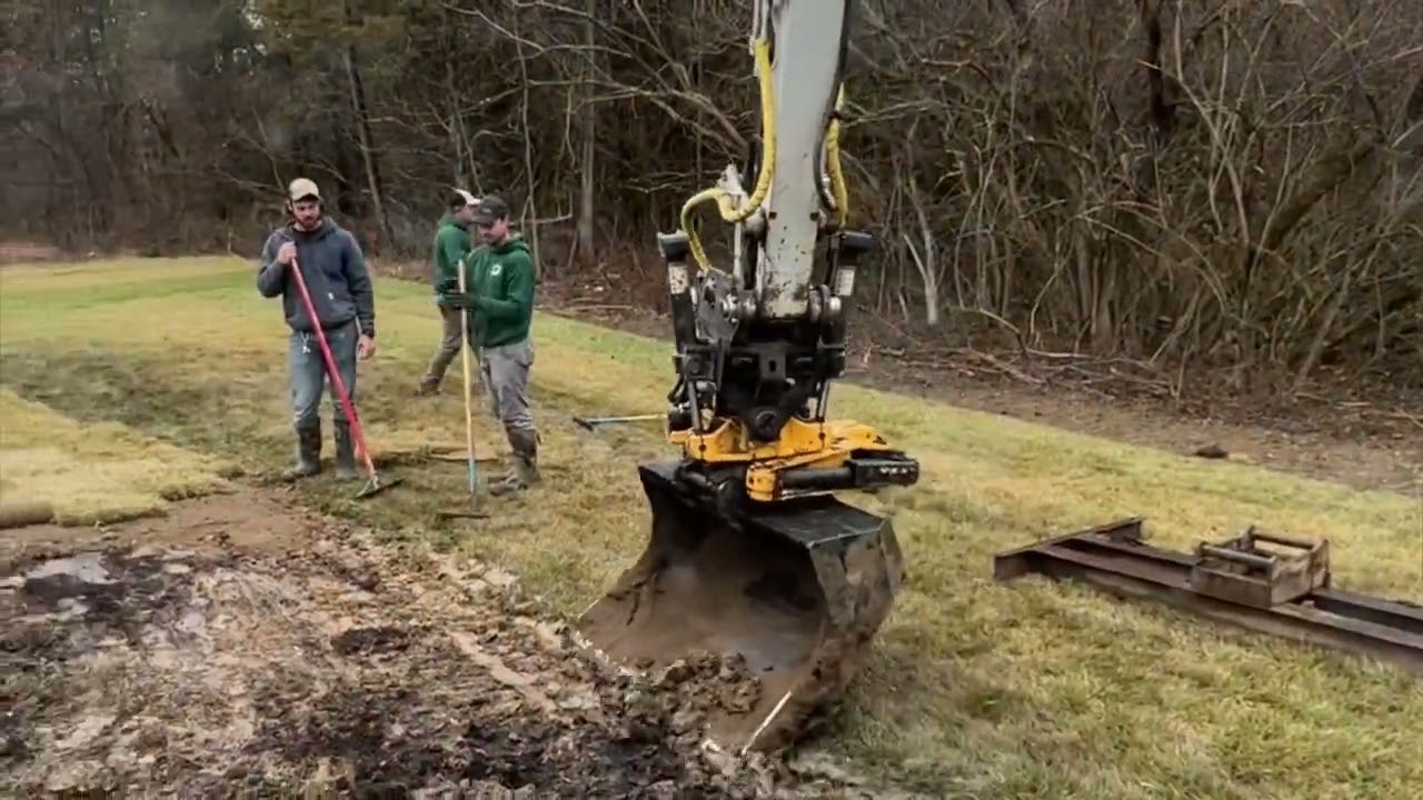 Engcon tilt rotator on Takeuchi tb290. Building a paver patio with a gas fire pit.