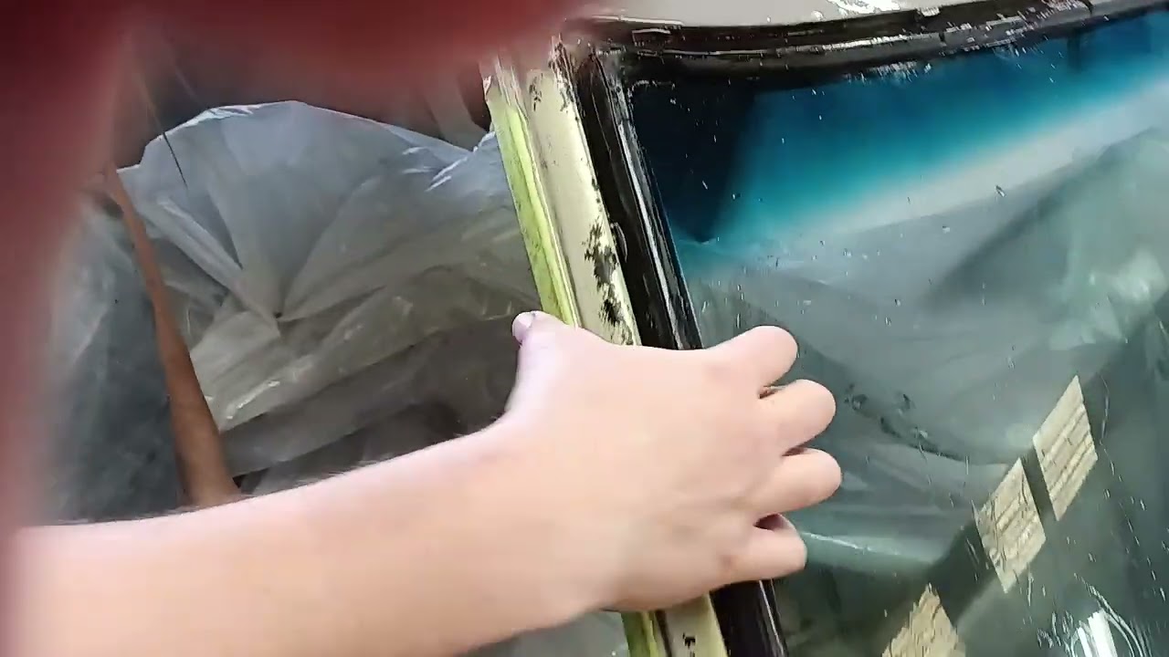 Putting a windshield in a 1969 road runner.