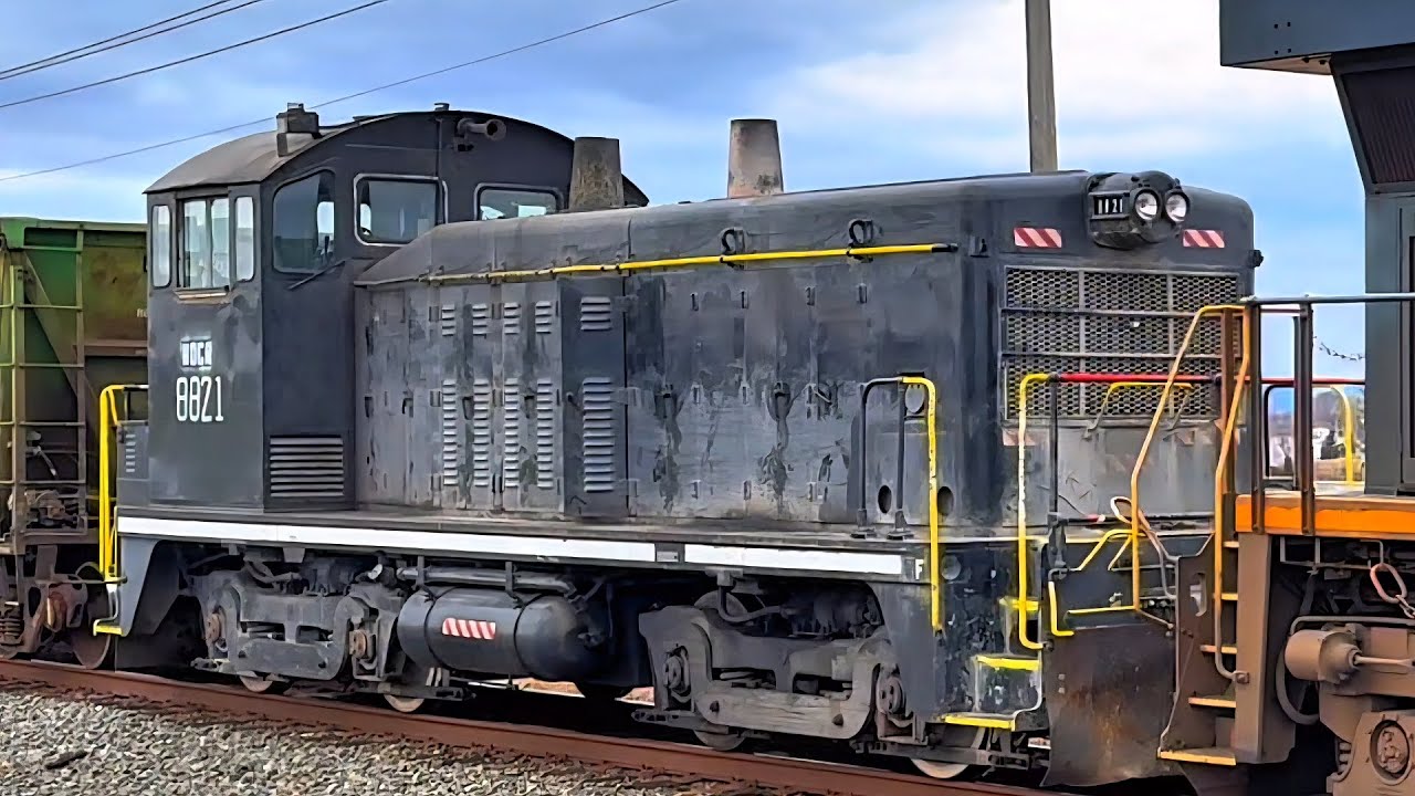 Super cool lash-up including a SD-40, CSX &  A NDCR switcher unit. Plus a decompressed flat car! 