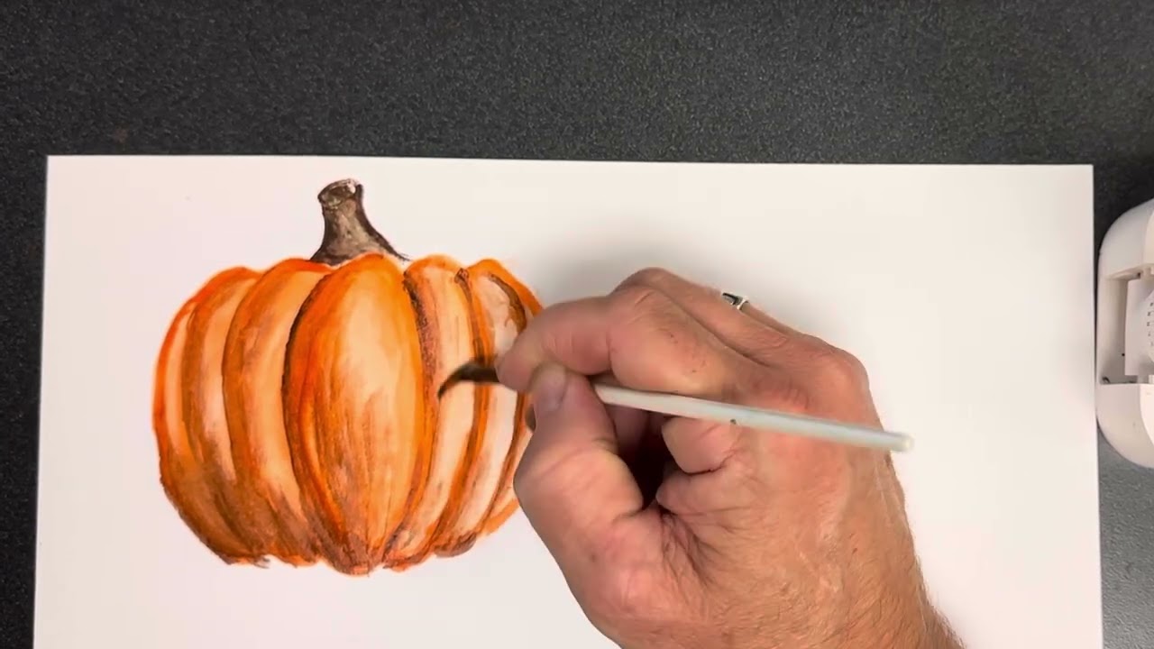 Watercolor Painting a pumpkin, vines, and fall leaf
