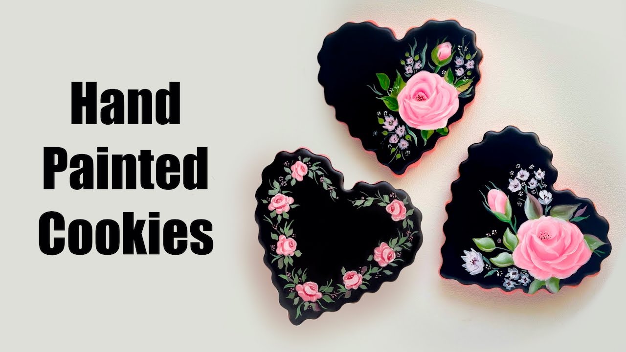 Hand painted roses on black heart cookies