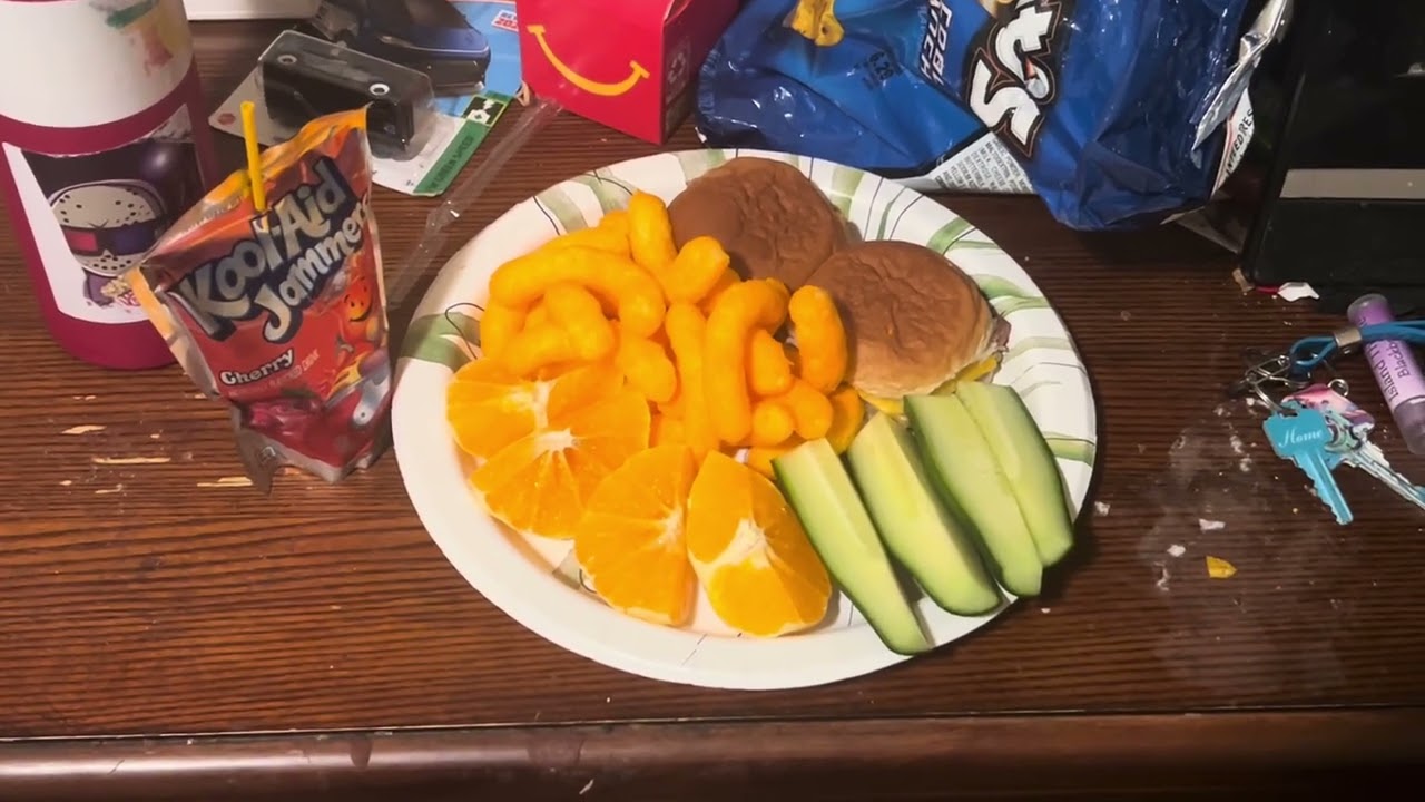 Mini Cheeseburgers, Cheeto Puffs, Orange Slices, Cucumbers, and Cherry Kool-Aid Jammer Juice