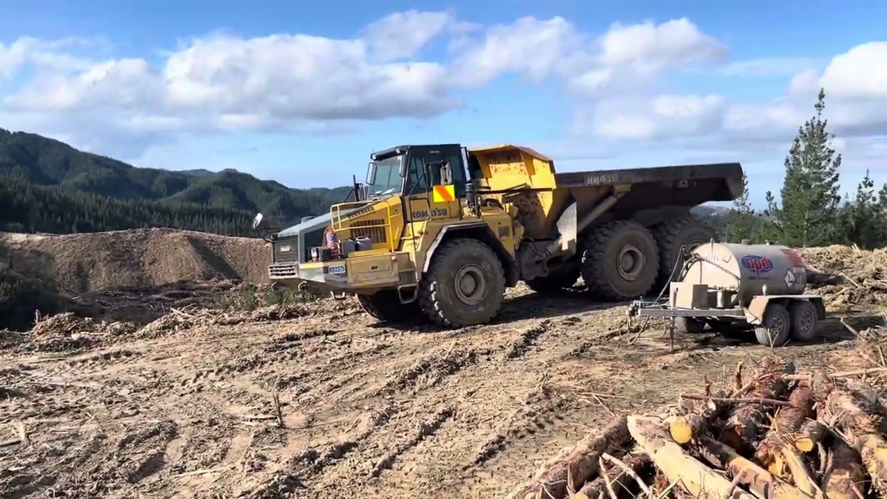 2 Staging logs with a 40 ton Komatsu dump truck