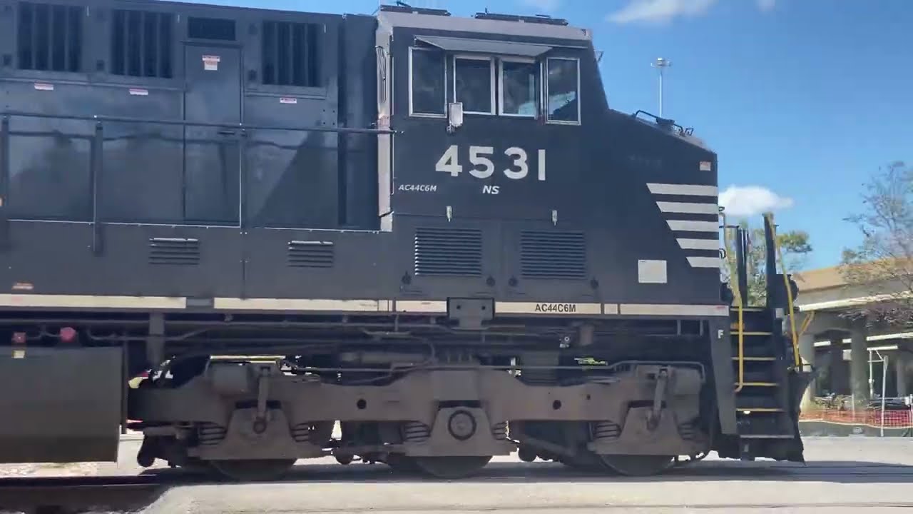 NS 820 with Eire heritage 1068 Sd70ace trailing