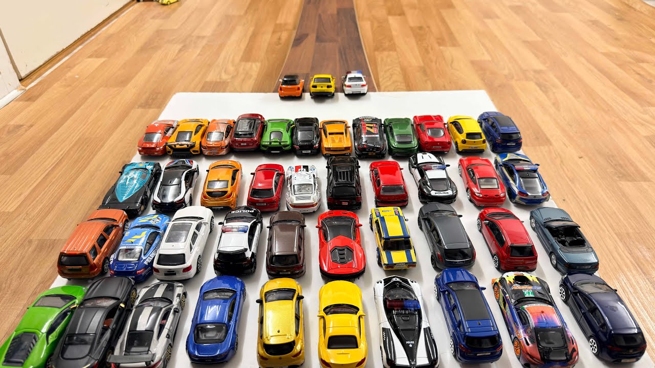 Lots Of Smaller Sized Toy Cars Sliding Down From The Slope
