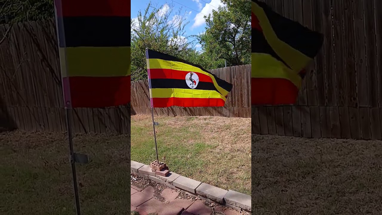 Big flag of Uganda waving in the wind