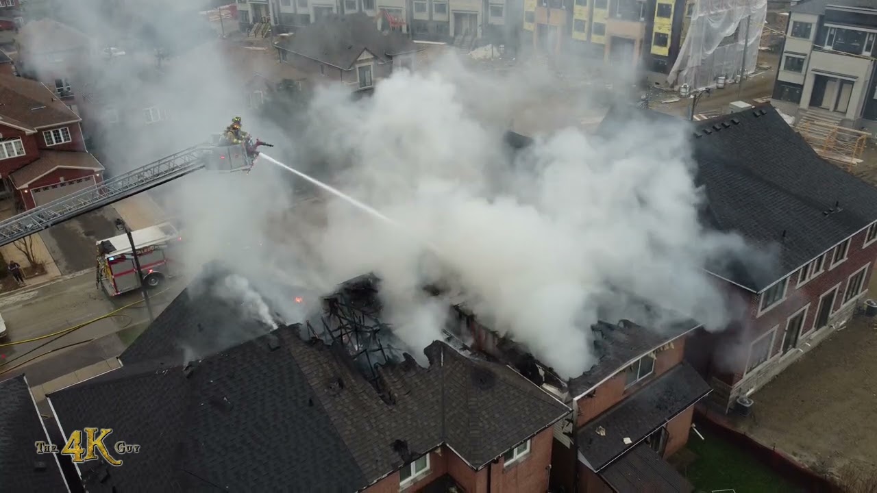 Bolton: Firefighters battling house fire from exposures aerial view 12-7-2022
