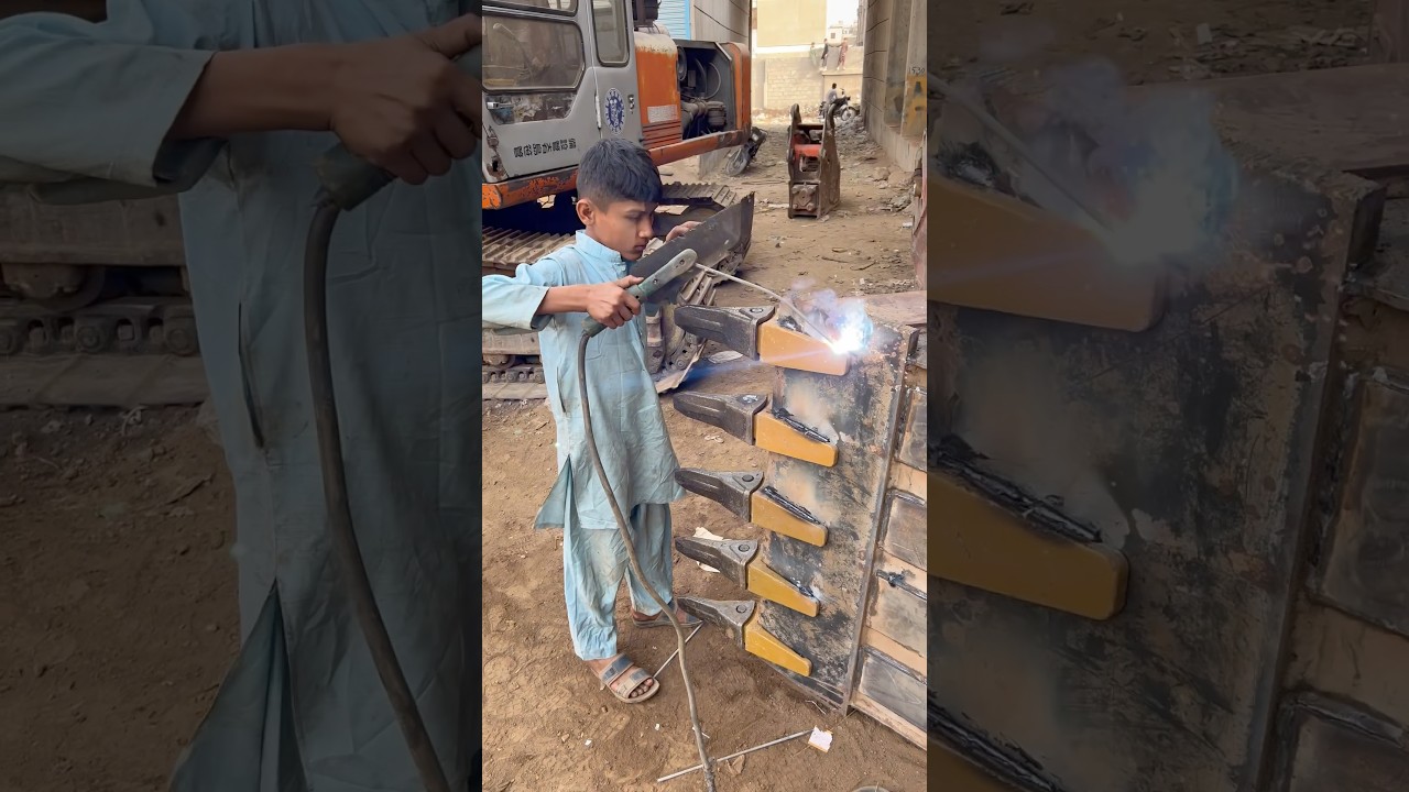 A small boy welding a excavator new bucket teeth #shortvideo #welding #excavator