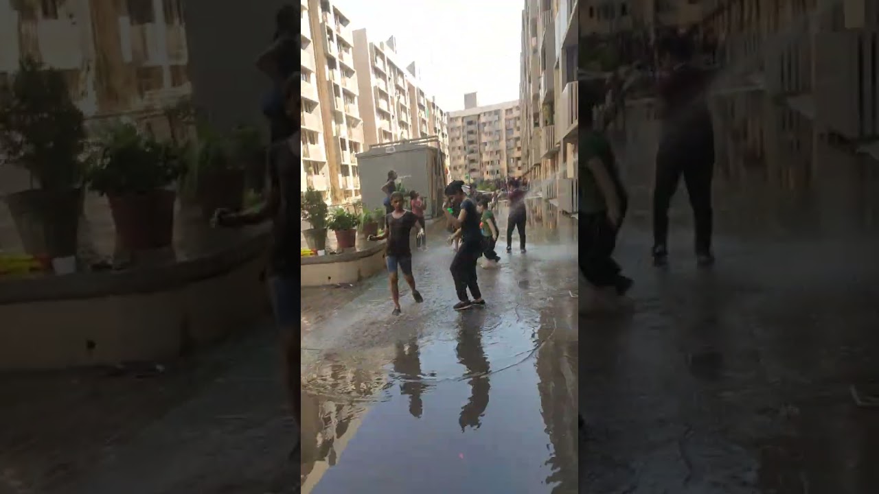 Holi celebration in Ahmedabad: Children playing with fire hose : Holi fever Water play : Kids Holi