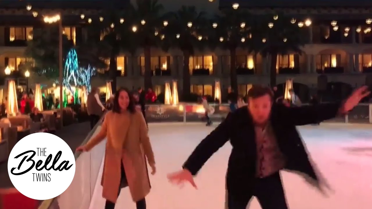 Brie helps a wobbly Bryan ice skate for the first time
