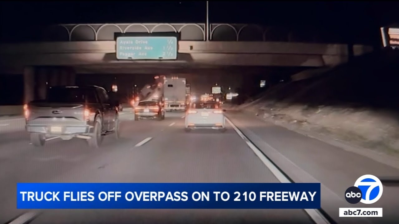 Truck flies off overpass and onto freeway below in wild crash