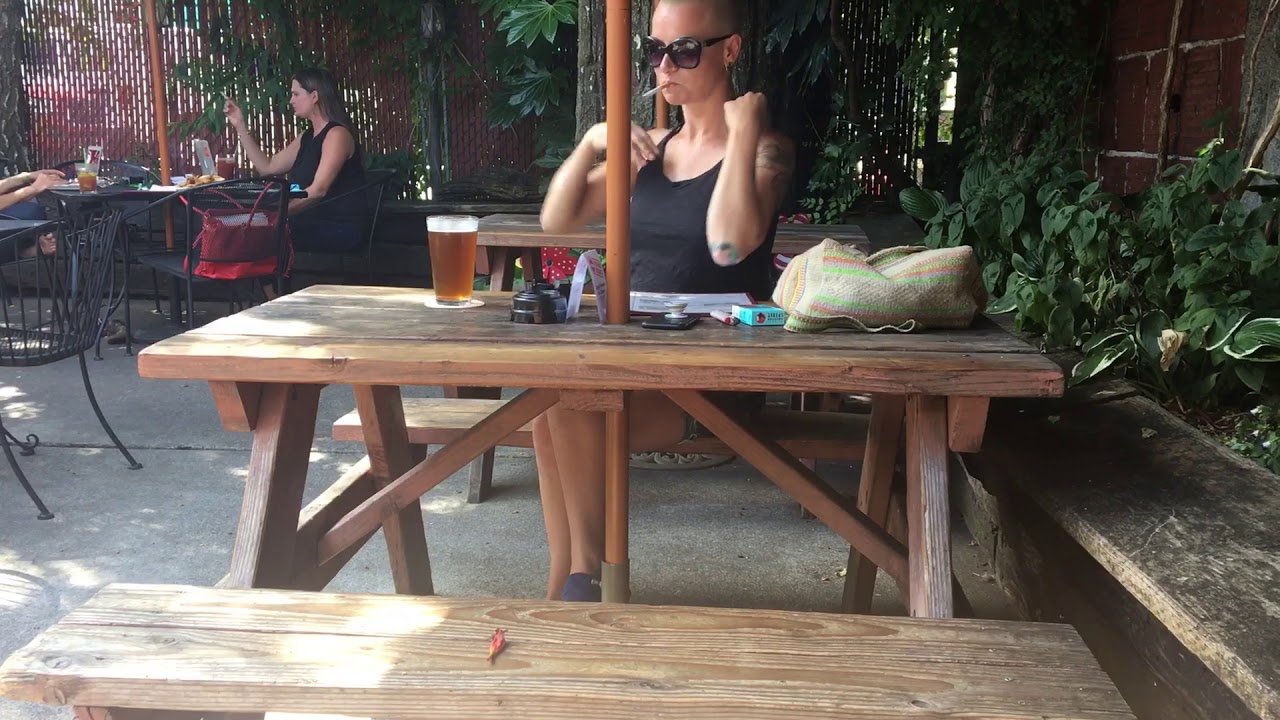 Smoking beauty shaved head