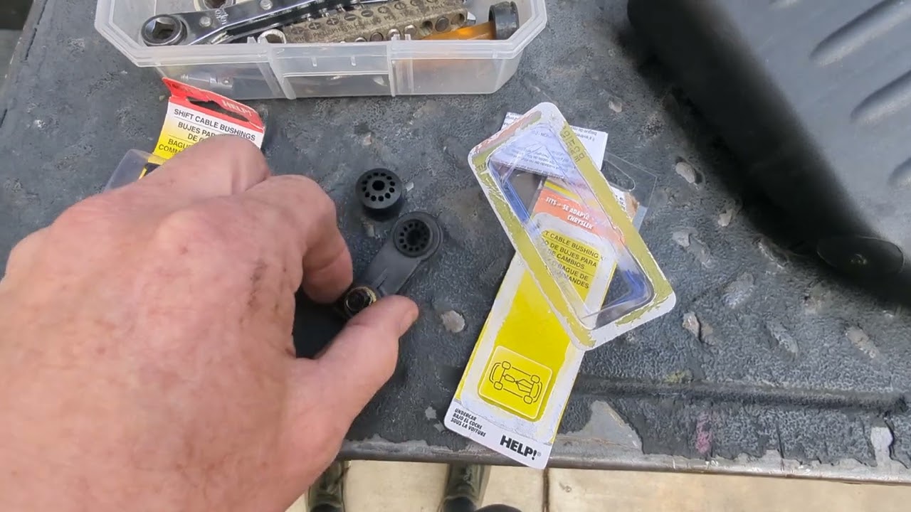 PT cruiser shifter cable bushings under the hood.