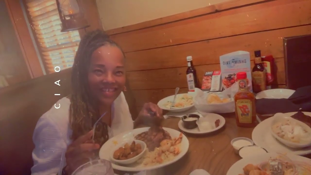 Gran and granddaughter having steak dinner