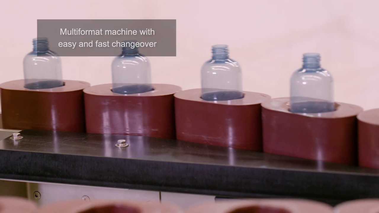 Unscrambler with bottle orienter and puck system - MINOR 100