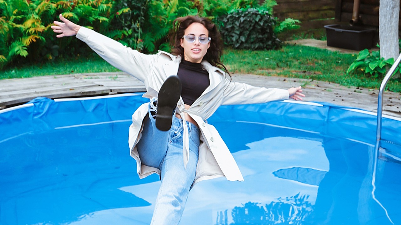 ELENA IN A COAT, JEANS FALLS COOLLY INTO THE POOL, POSSES AND ENJOYS IT [WETLOOKER ID: b54-elena3]