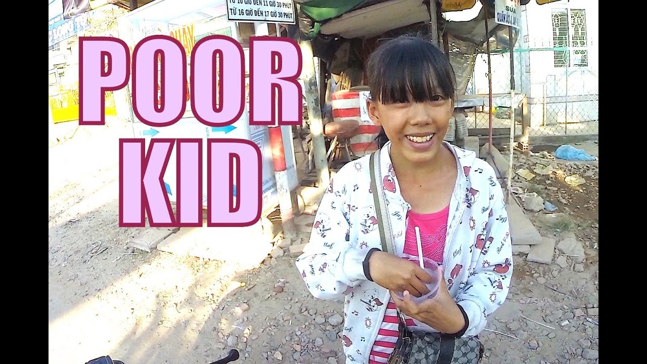 Giving money to a poor kid. Can Tho Vietnam.