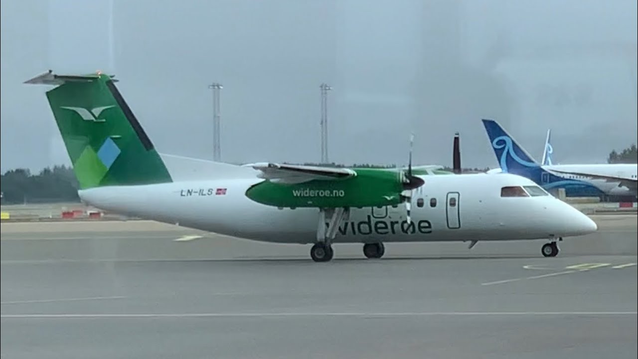 Widerøe Dash8-100 ( New Livery ) ( LN-ILS ) landing and parking at the gate at Oslo Gardermoen OSL