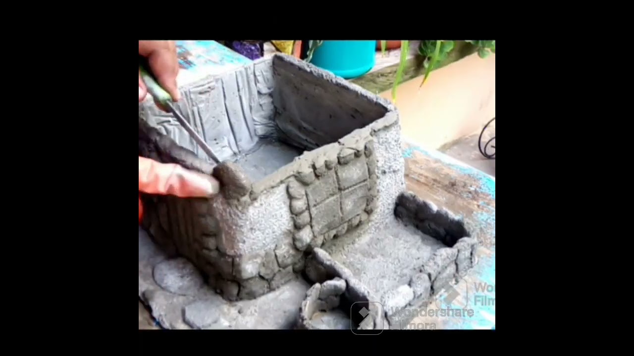 maceta en forma de casita hecha con cemento, 🏡