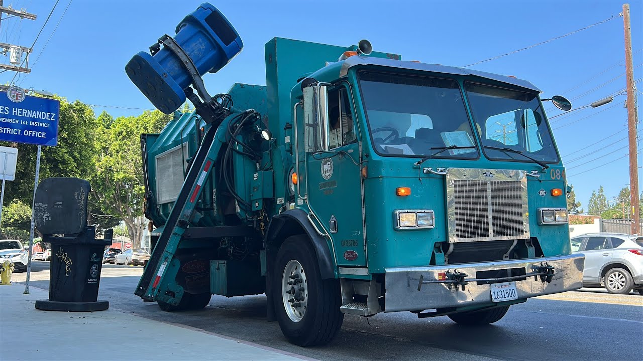 Old Mini Amrep Garbage Truck on Automated Litter Bins