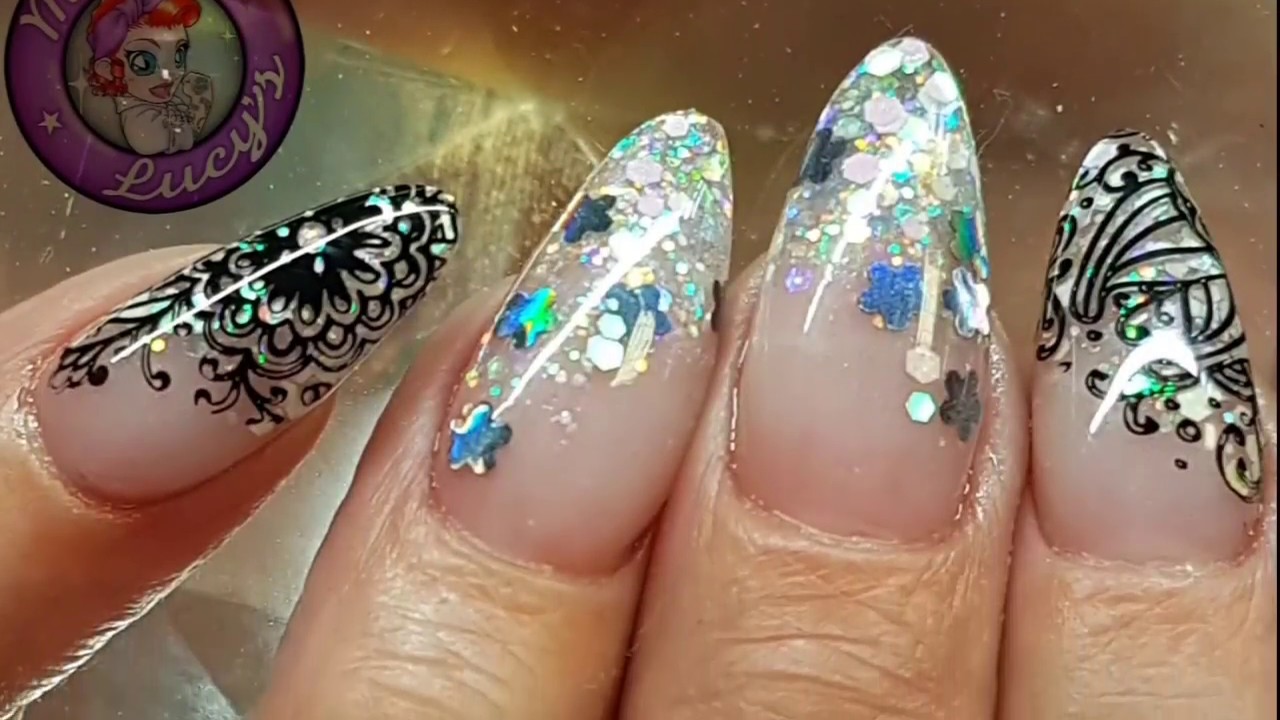 Acrylic nails with embedded glitter and stamping
