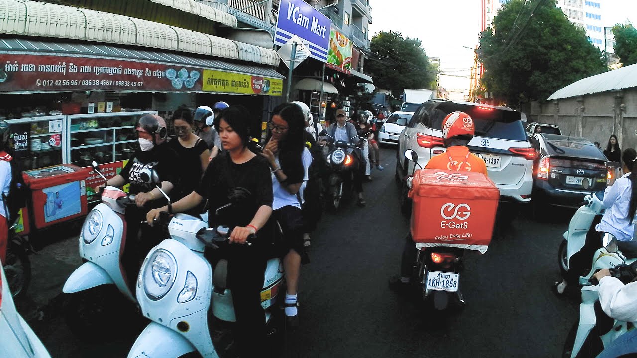 On the streets of Phnom Penh, Cambodia, people's journeys in the city, travel video