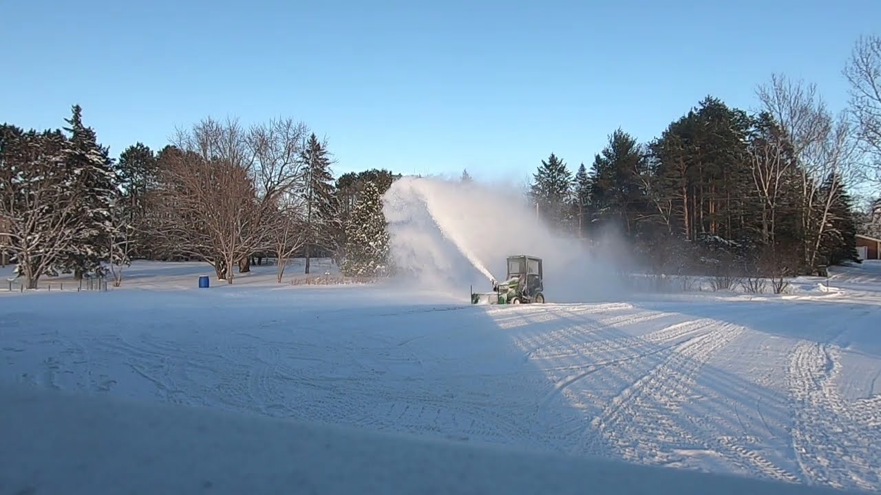 John Deere x590 with snow blower and cab.