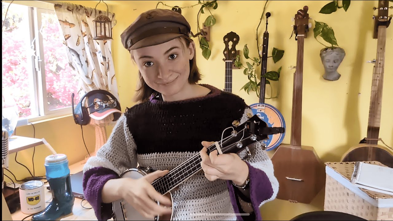 Playing the banjolele in an epic sweater