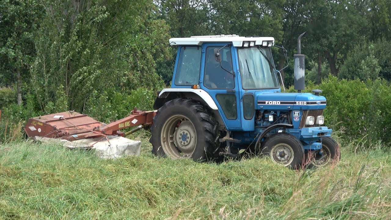 Ford 5610 Gen III met Kuhn FC 202 aan het maaien voor hooi (2019)