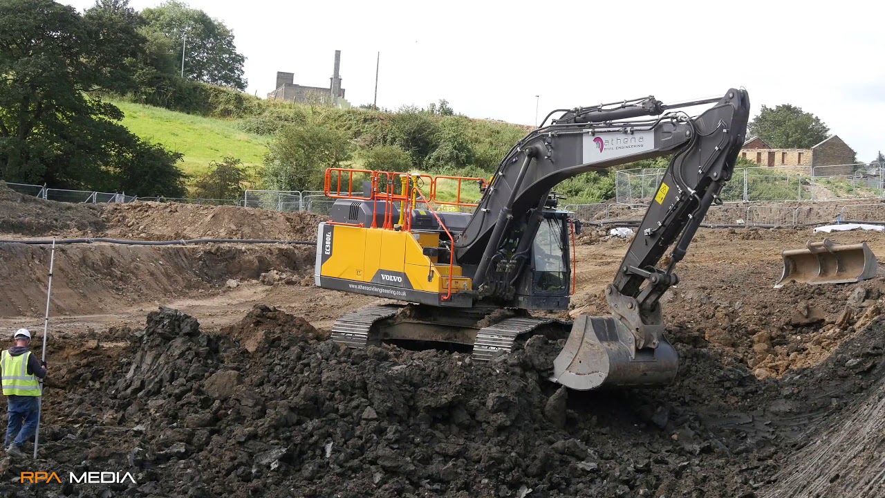 NEW Volvo EC380EL excavator digging out for a water retention tank on a Yorkshire housing scheme.