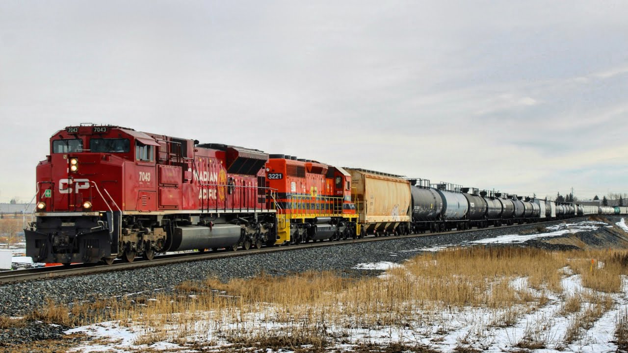 SUPER RARE! CP 7043 leading CPKC mix freight and IORY 3221 G&W unit trailing Westbound at Ogden 