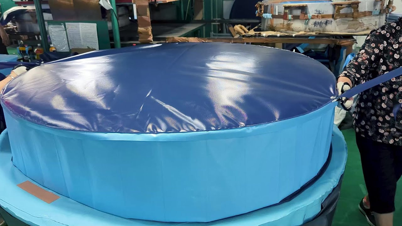 Process of making foldable dog pool. A swimming ring production factory.