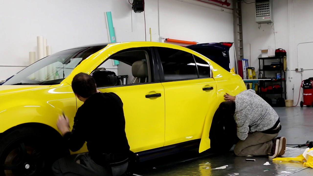 Full yellow wrap on Subaru Legacy Gt by D&A Customs . Seattle | Tukwila car wraps.