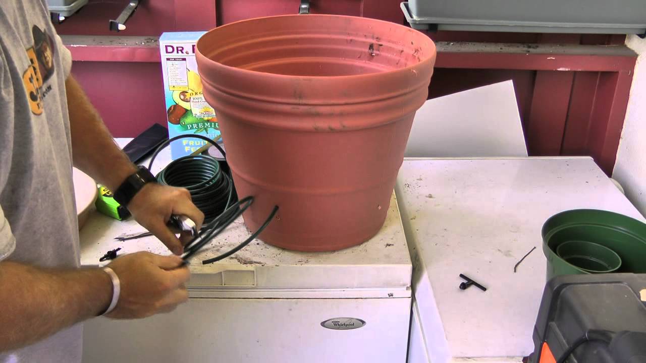 A cost effective self-watering plant system