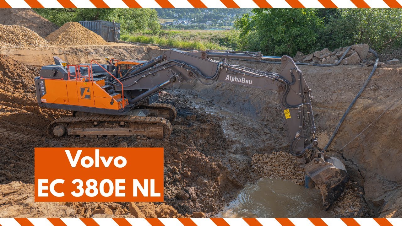 Mighty Volvo EC 380E with a two piece boom working on a water retention site