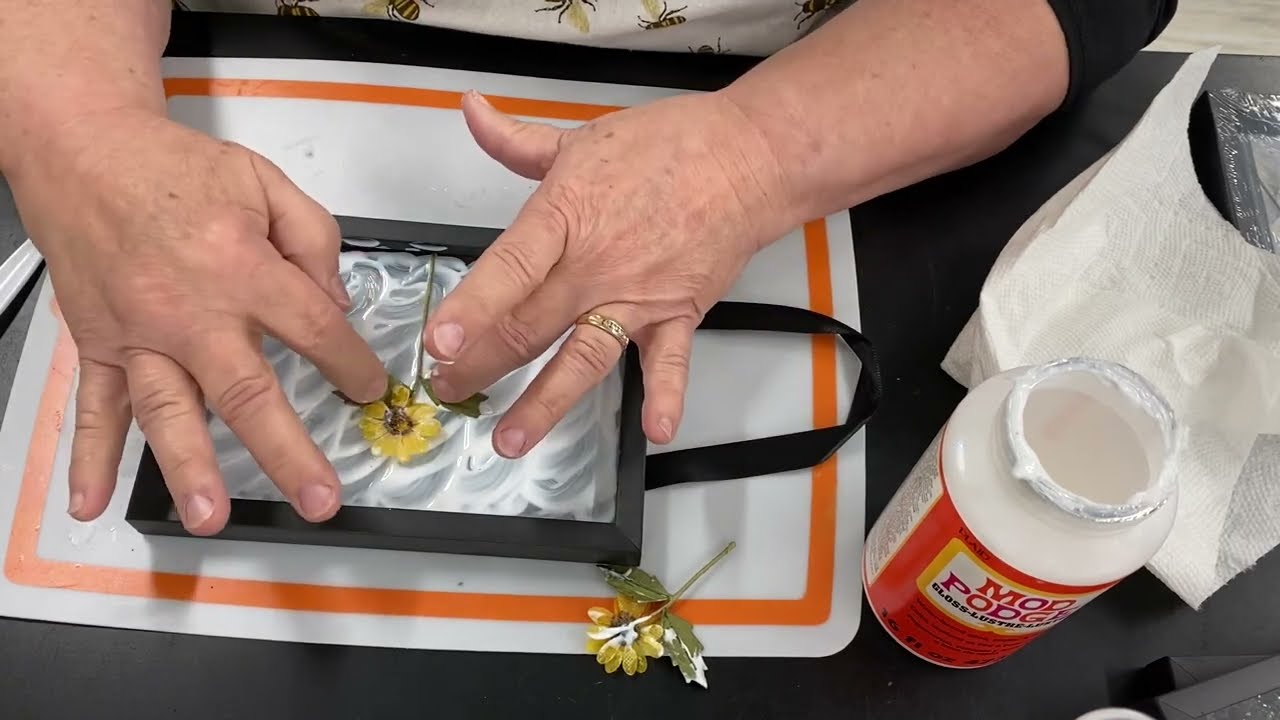 Mod Podge on glass in picture frame with paper flowers 2023