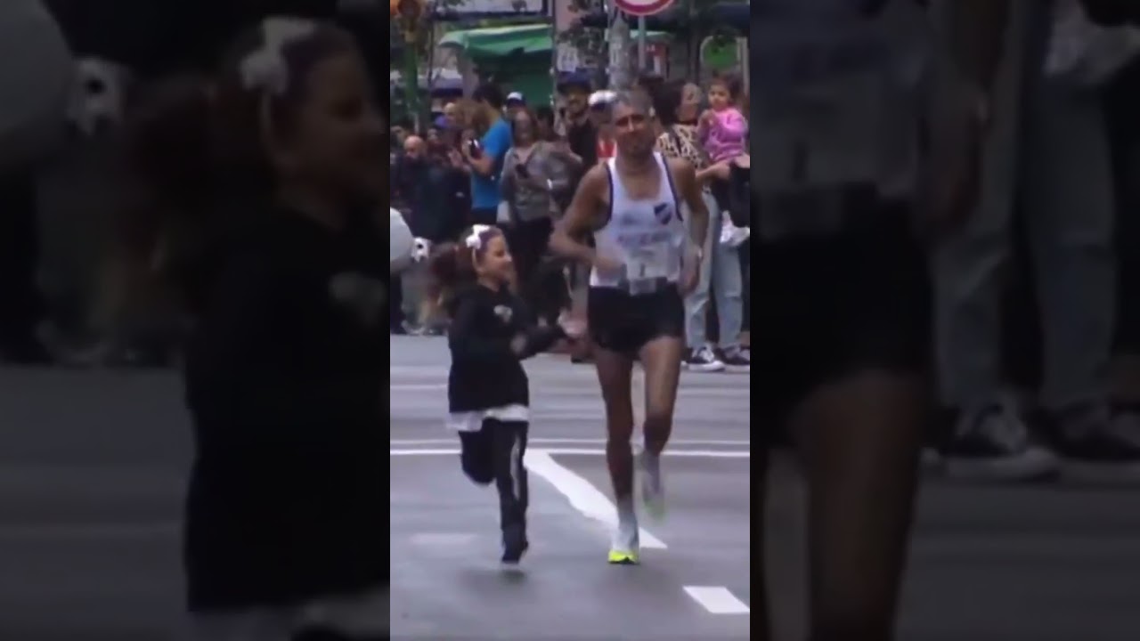 Girl support her father in a Marathon run in the final stage