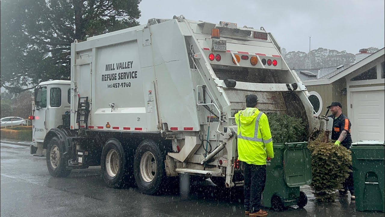 Quick Mill Valley Rear Loader Garbage Truck on heavy yard waste