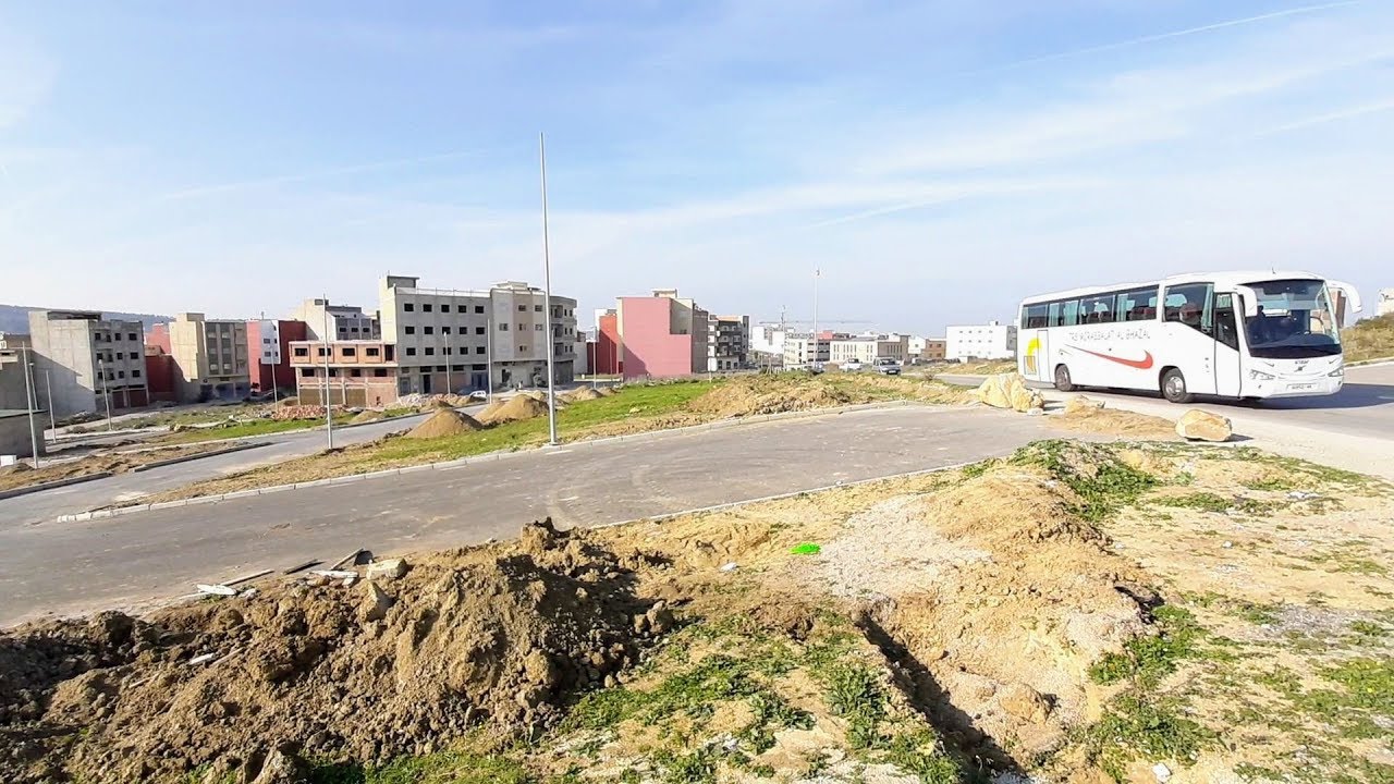أرض للبيع في طنجة تجزئة كزناية 2 قطعات لهما وجهتان شارع 20