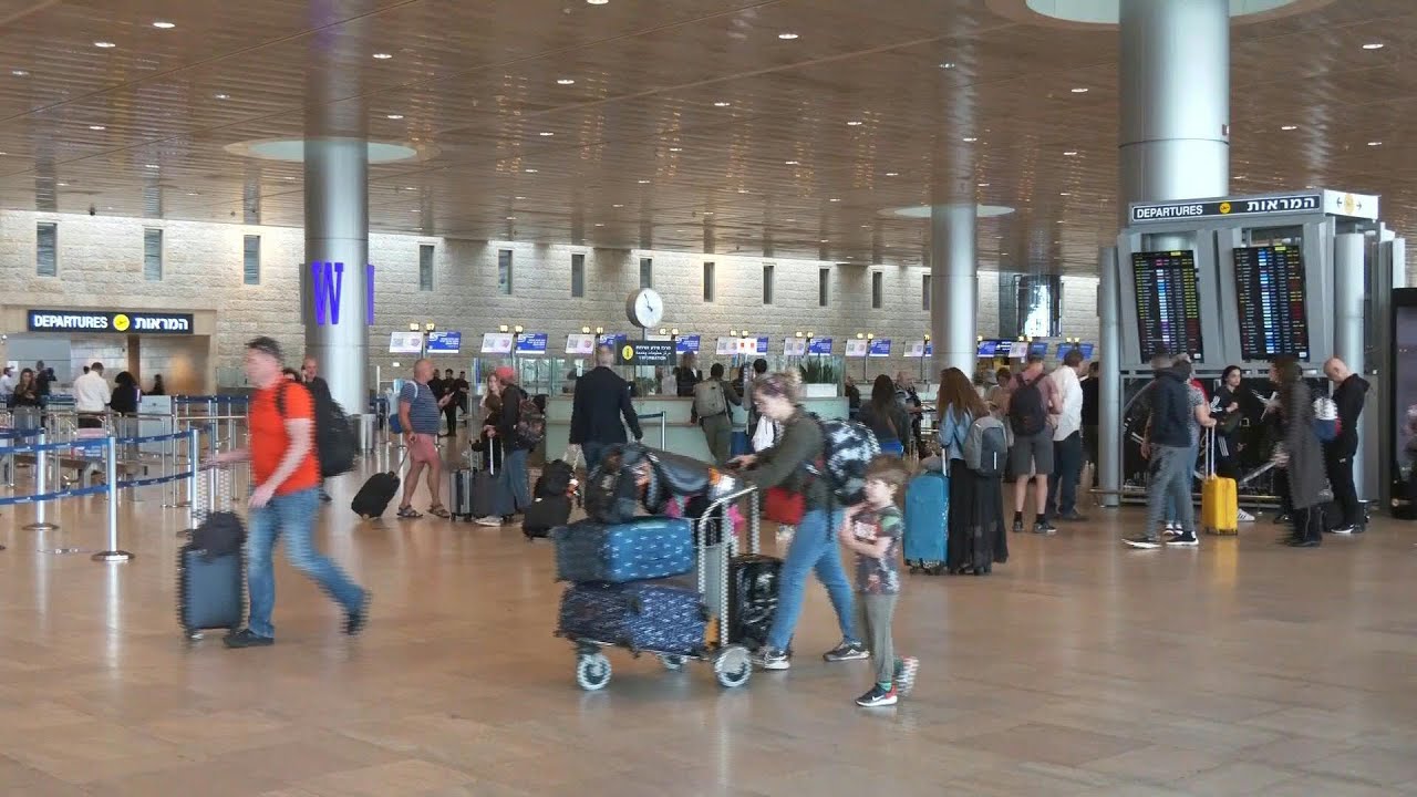 Travellers at Tel Aviv airport after reopening following Iranian attack | AFP