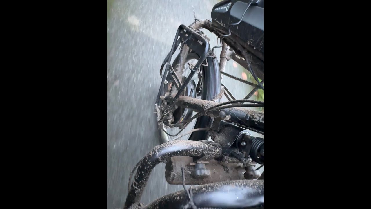 Negotiating traffic and puddles & a flat tyre on hand-cycle