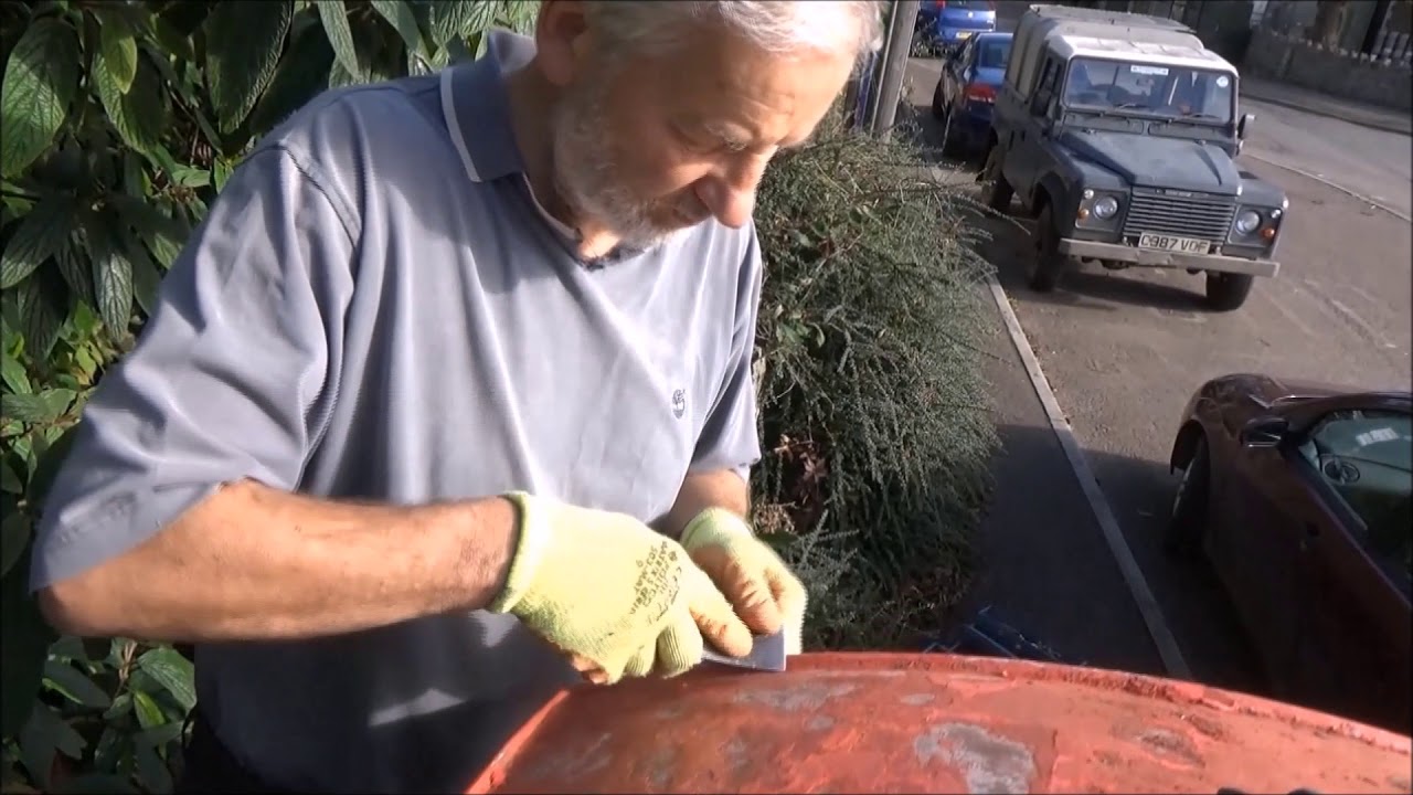 Restoring the village phone box.Part 2. Scraping the paint off