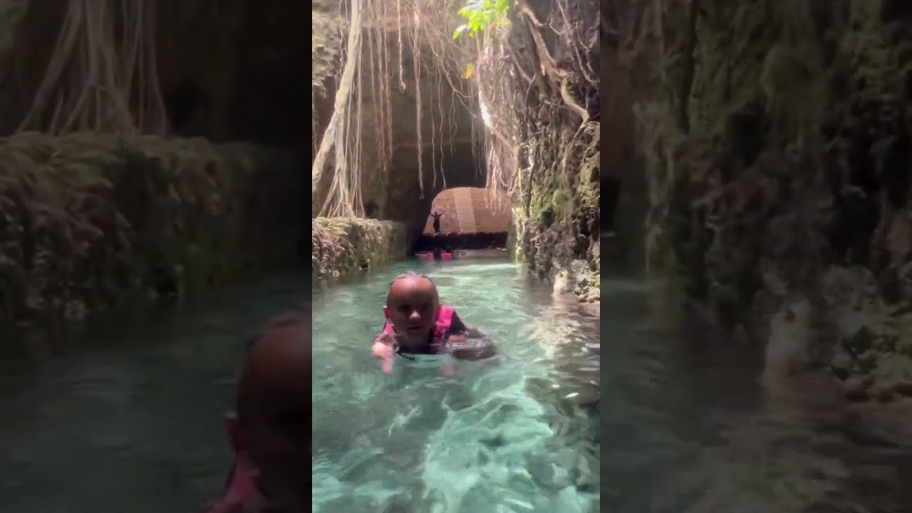 Tali swims through the underground rivers at Xcaret in Mexico