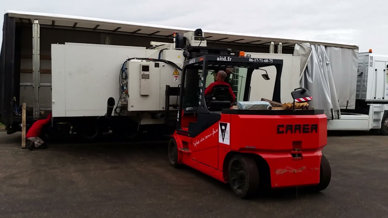 Manutention et chargement d’une machine centre d’usinage avec chariot 16T