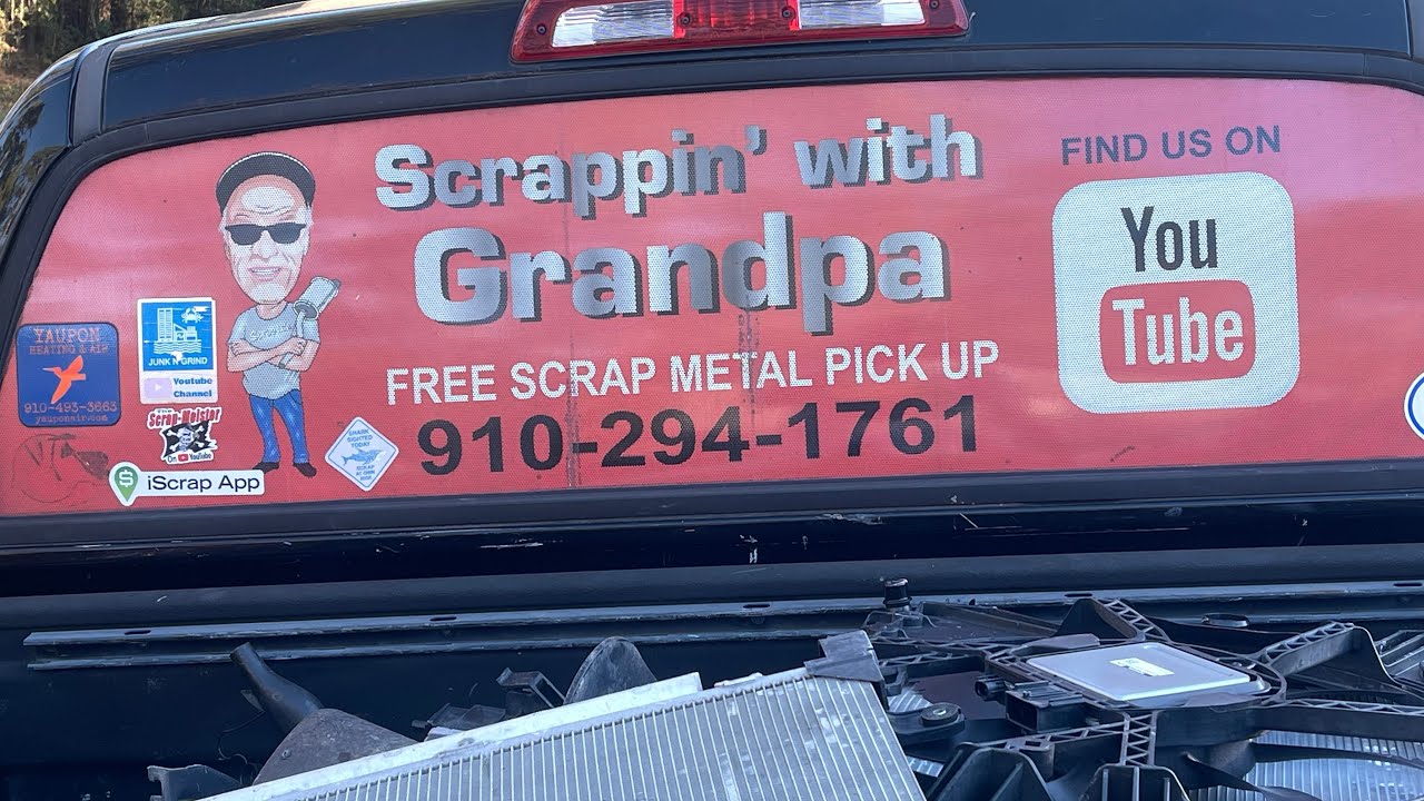Loading my trailer with scrap metal for Foss recycling.