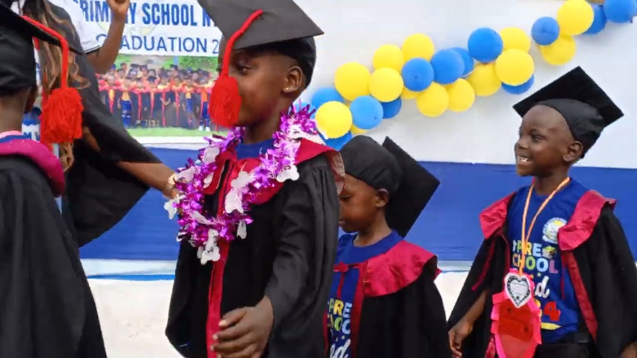 TOP CLASS GRADUANDS arriving on stage on their graduation day.