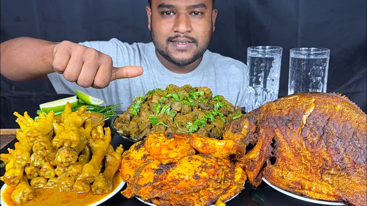 spicy mutton liver curry, full fish fry, chicken feet curry and egg omelette curry with rice eating